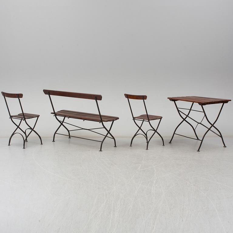 A garden sofa, table and a pair of chairs, first half of the 20th century.
