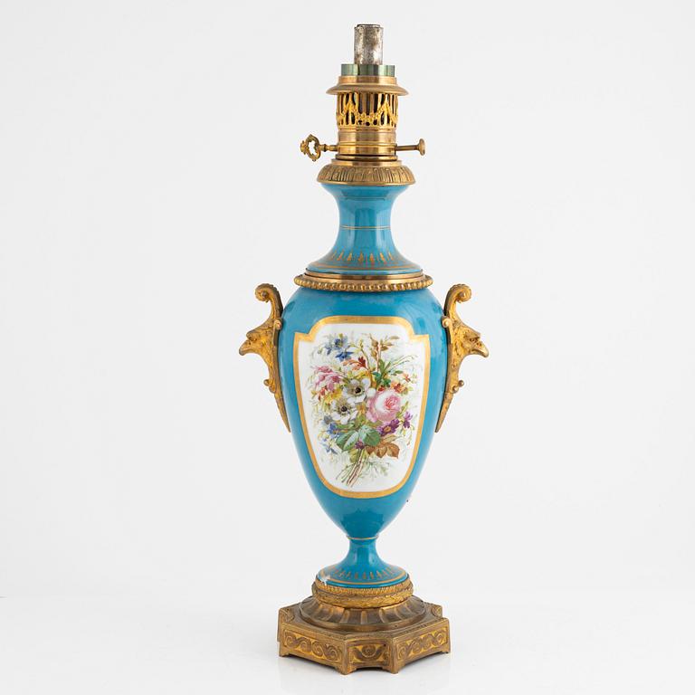 A gilt-brass and porcelaine Louis XVI-style kerosene lamp, later part 19th century.