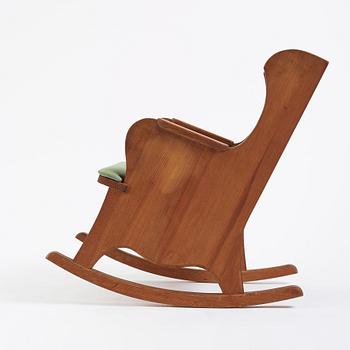 Nordiska Kompaniet, a Swedish Modern stained pine 'Lovö' rocking chair, 1940s.