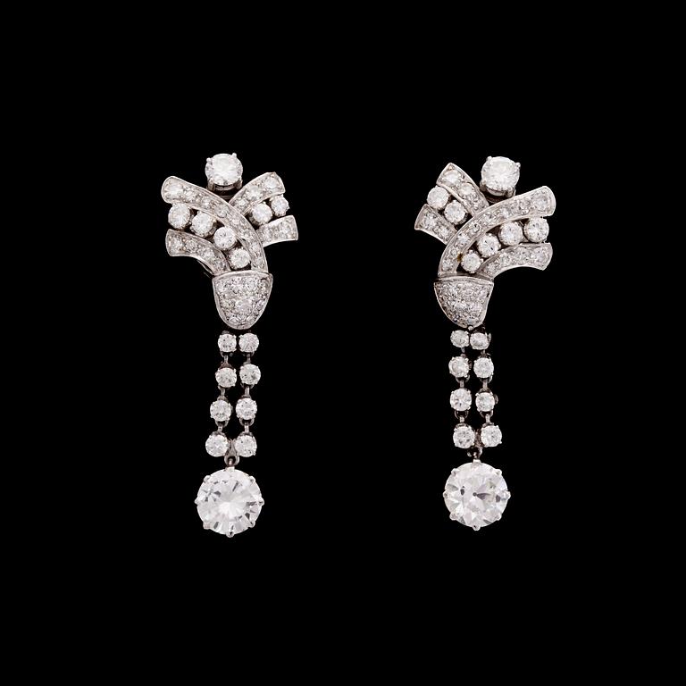 A pair of brilliant cut diamond earrings, tot. app 4.20 cts, 1950's.