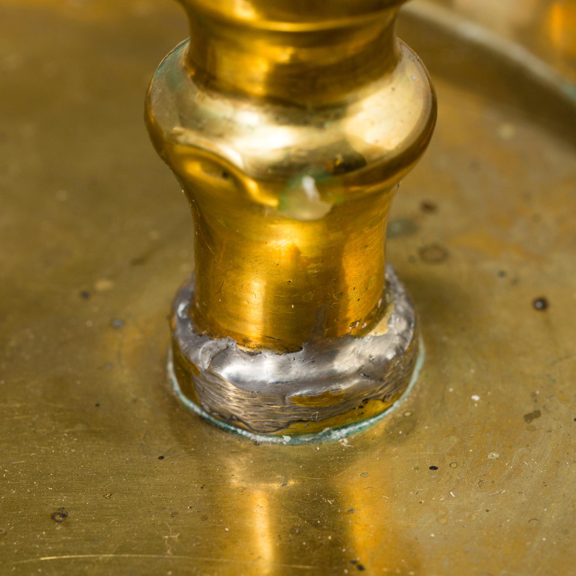 A 19th century bra candleholder for two candles and candle wick-trimming scissors.