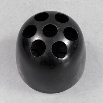 EMMA GISMONDI SCHWEINBERGER, a 'Dedalo' plastic umbrella stand from Artemide, Milan, Italy.