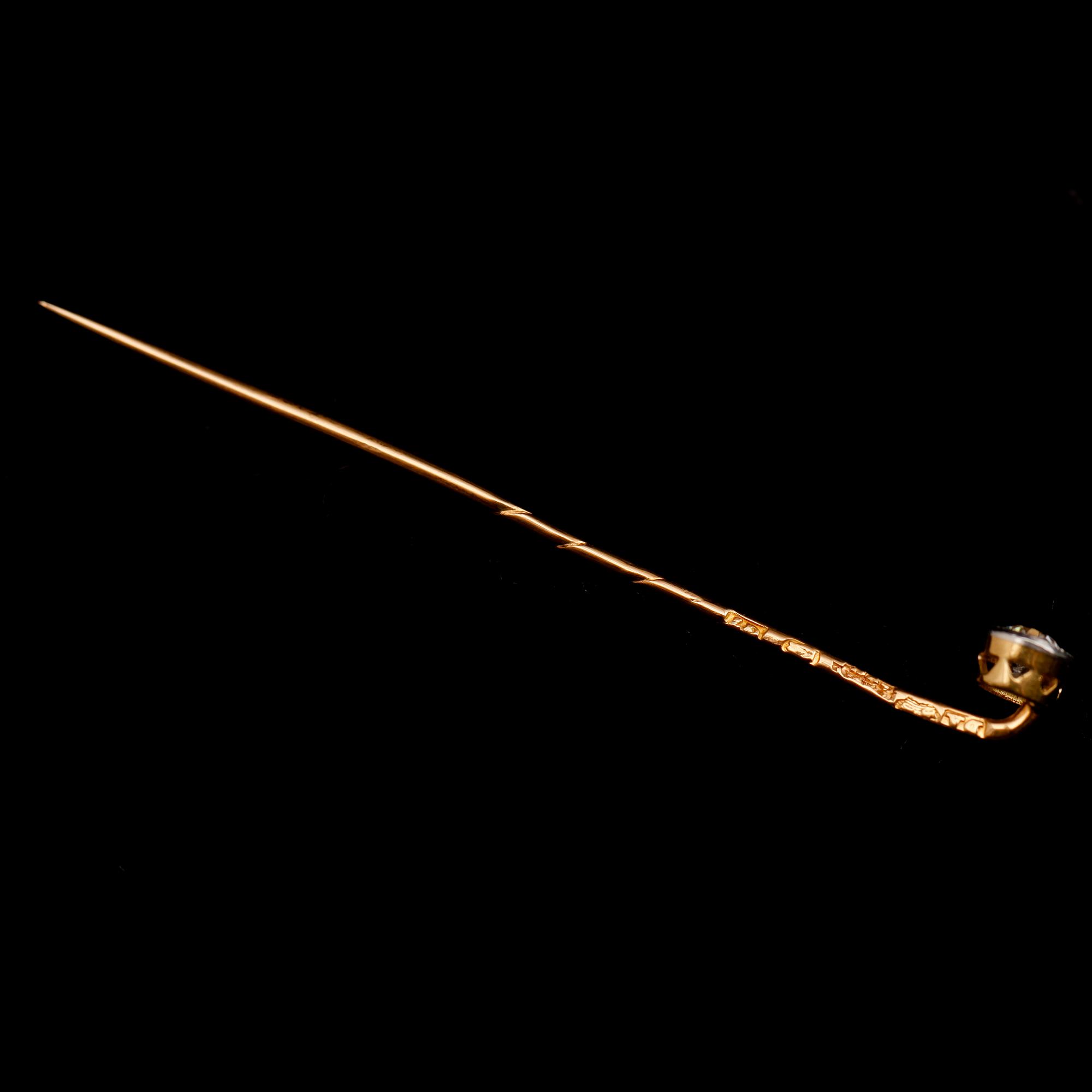 BROSCHNÅL, 18 k guld, med briljantslipad diamant.