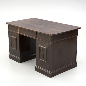 An early 1900s oak writing desk.