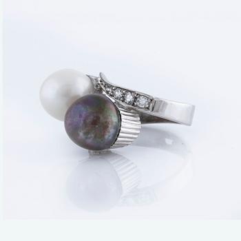 A cultured pearl and single cut diamond ring.