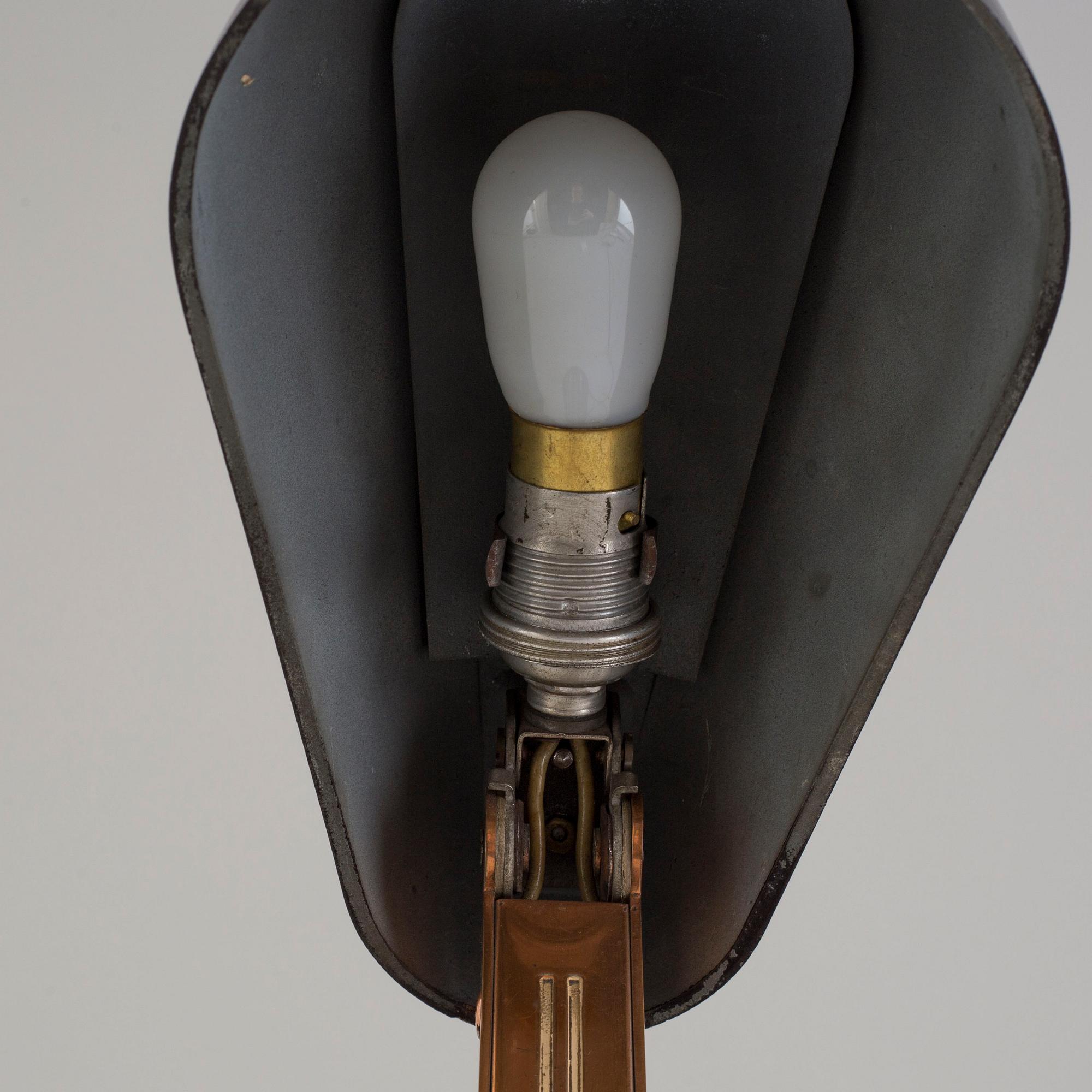a bakelite and metal table 'Bolide' table lamp, by JUMO, 1940's.