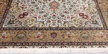 A Tabriz carpet, part silk, so-called 50 Raj, approx. 348 x 252 cm.