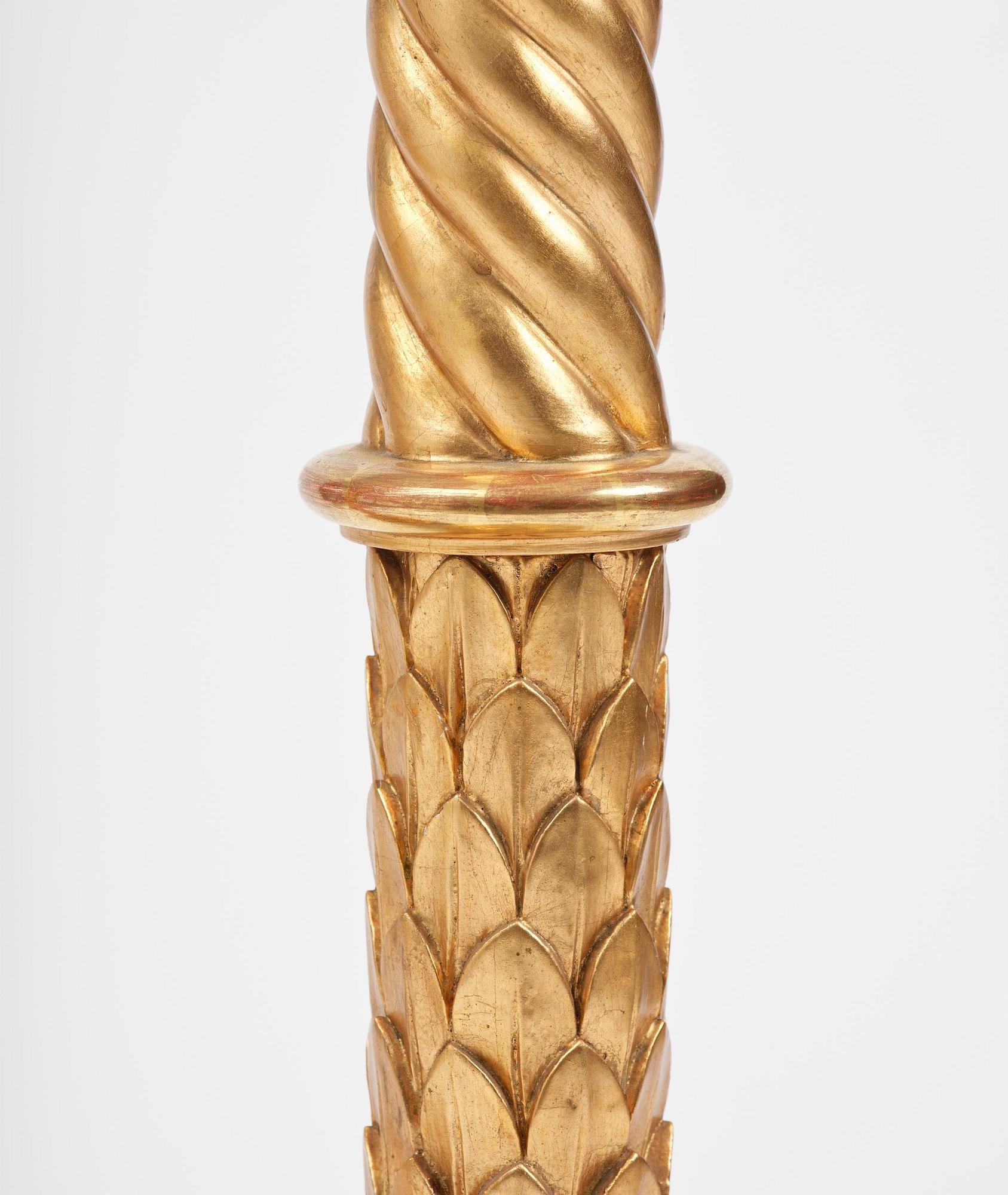 A pair of late Gustavian giltwood torchères by J. Frisk (master in Stockholm 1805-24).