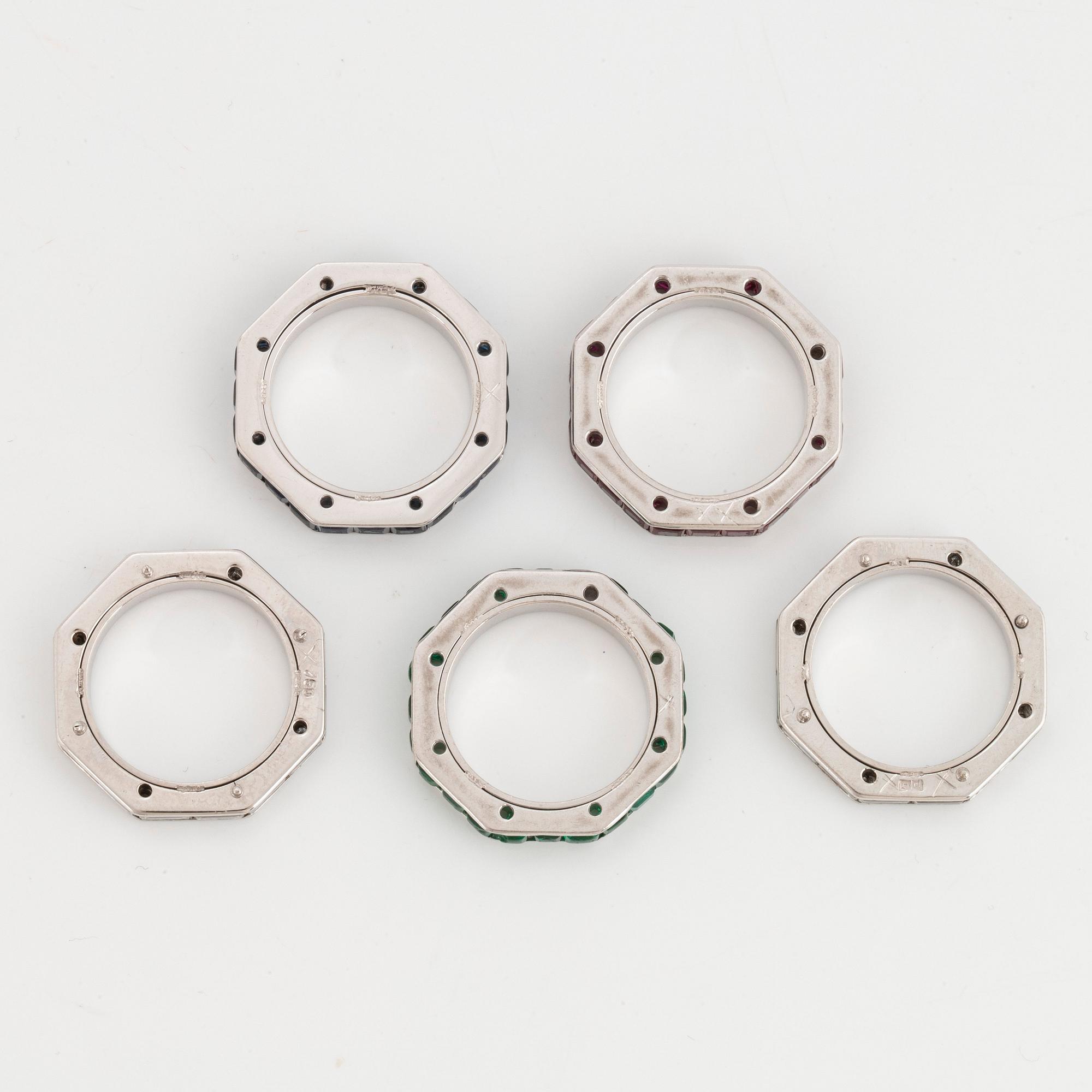 Five Paul Binder rings in 18K white gold set with baguette- and round brilliant-cut diamonds.