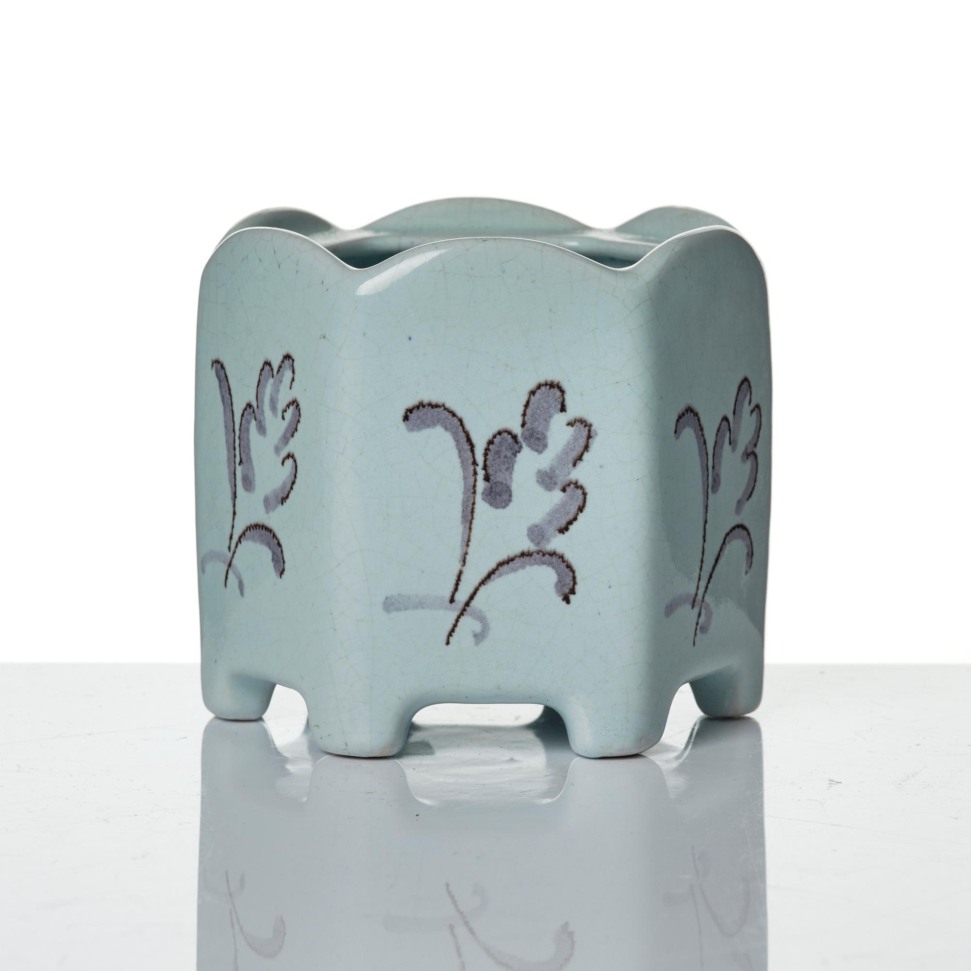 Wilhelm Kåge, eleven pieces of faience including jars, inkwells and a tulip vase, Gustavsberg, Sweden, 1919-1920.