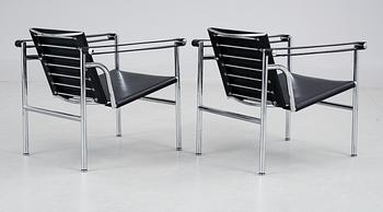 A pair of Le Corbusier 'LC 1' black leather  and chromed steel armchairs, Cassina, Italy.