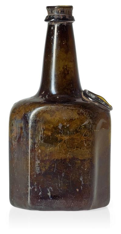 A Swedish green glass bottle, dated 1751.