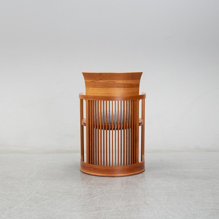 A model 606 'Barrel' chair by Frank Lloyd Wright for Cassina, designed 1937.