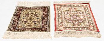 Rugs, two smaller Hereke, silk. 64x44 and 46x43 cm.