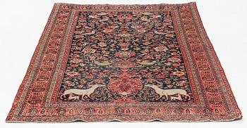 An oriental rug, signed, 126 x 205 cm.