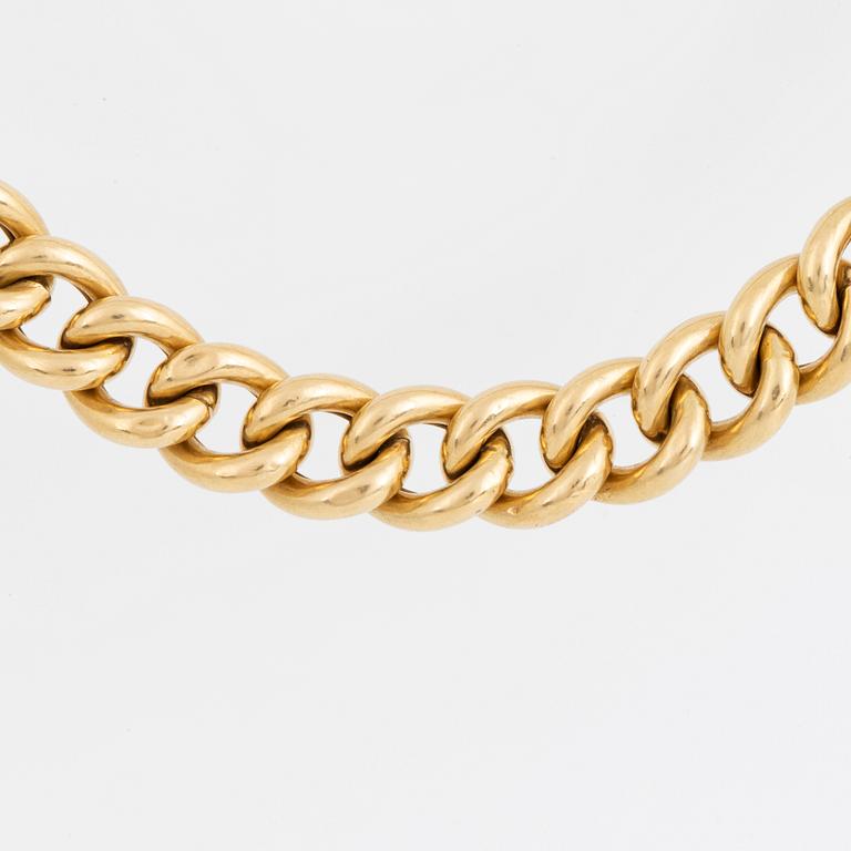 18K gold curb link necklace.
