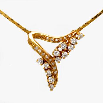 An 18K gold necklace with round brilliant cut diamonds.
