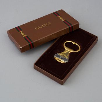 GUCCI, bottle opener.