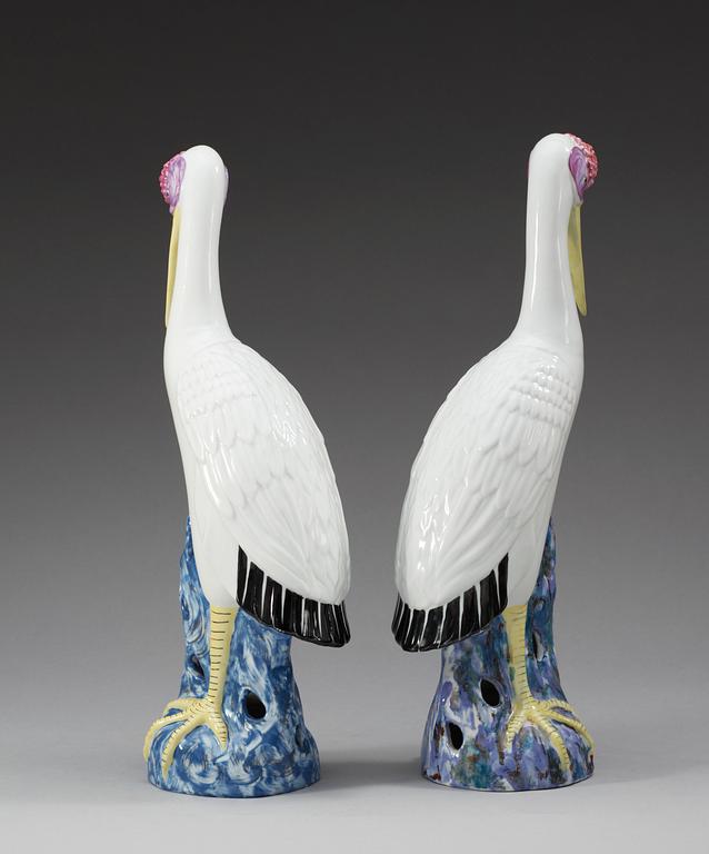 A set of two famille rose figures of cranes, Chinese presumably early 20th Century.