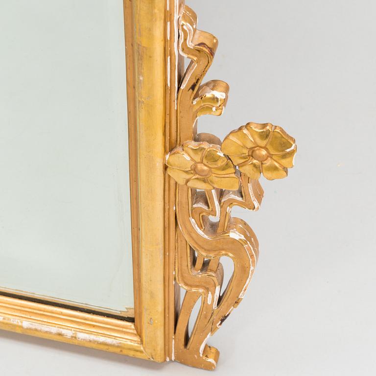 An Art Nouveau mirror with console table from early 20th century.