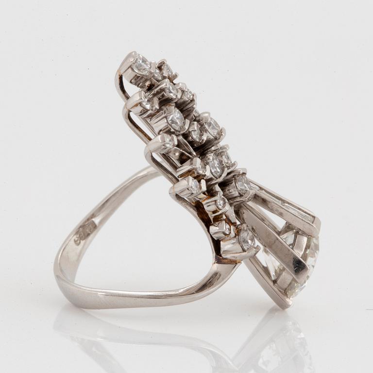 A platinum ring set with an old-cut diamond ca 2.25 cts quality ca I/J si2.