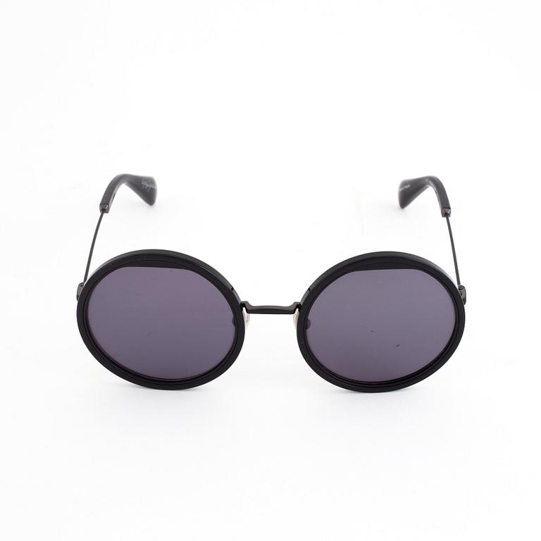 A pair of Yohji Yamamoto sunglasses.