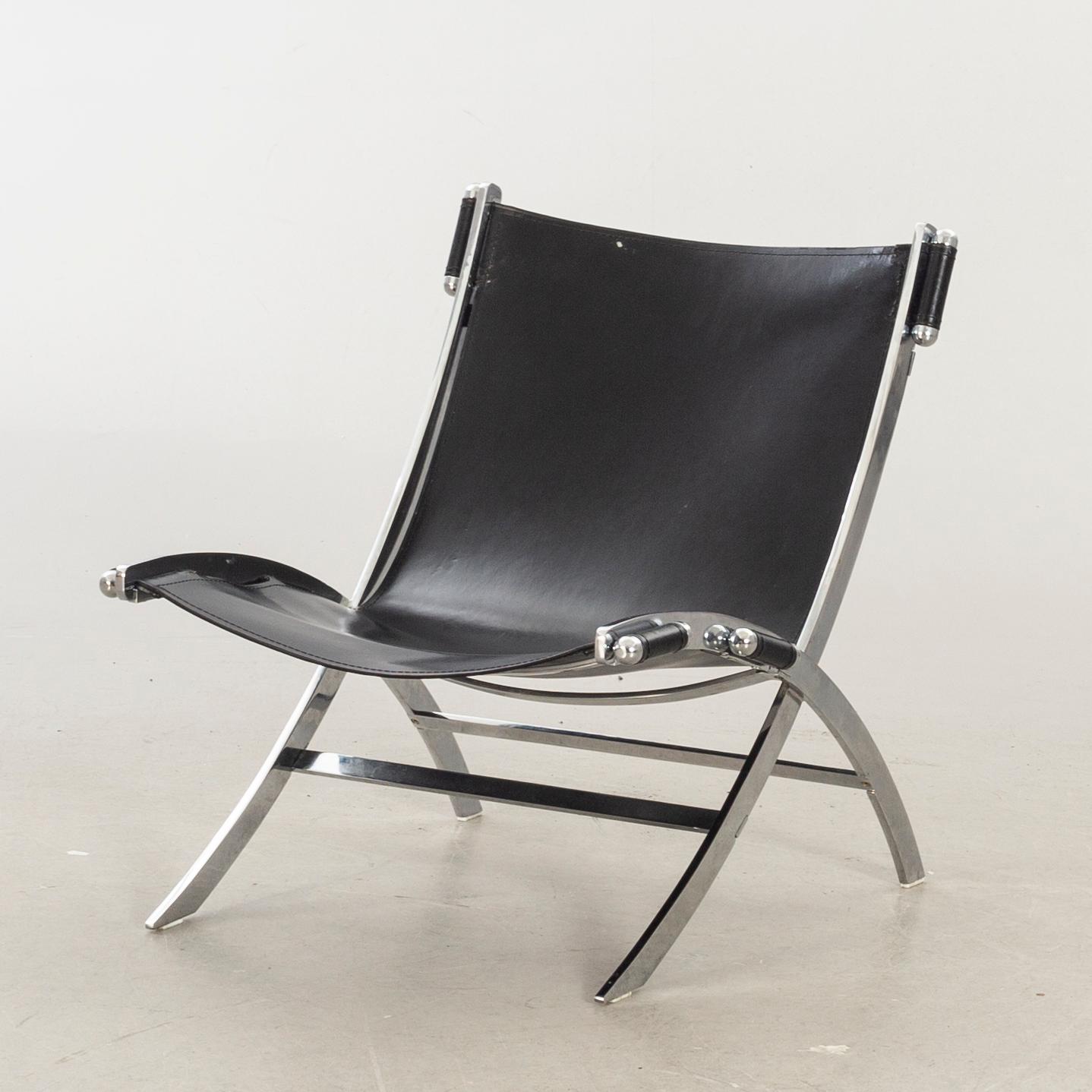 Paul Tuttle For Flexform Lounge Chair In Chrome And Black Leather.