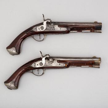 An end of the 18th century pair of converted percussion pistols.
