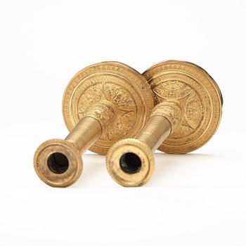 A pair of Empire early 19th century candlesticks.