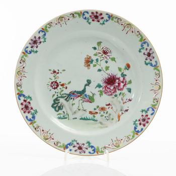 A Chinese famille rose porcelain 'double peacock' plate, Qing dynasty, Qianlong (1736-95).