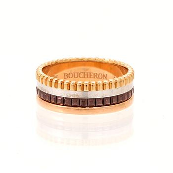 A “Quatre” ring in 18K yellow, pink, white gold and brown PVD by Boucheron.