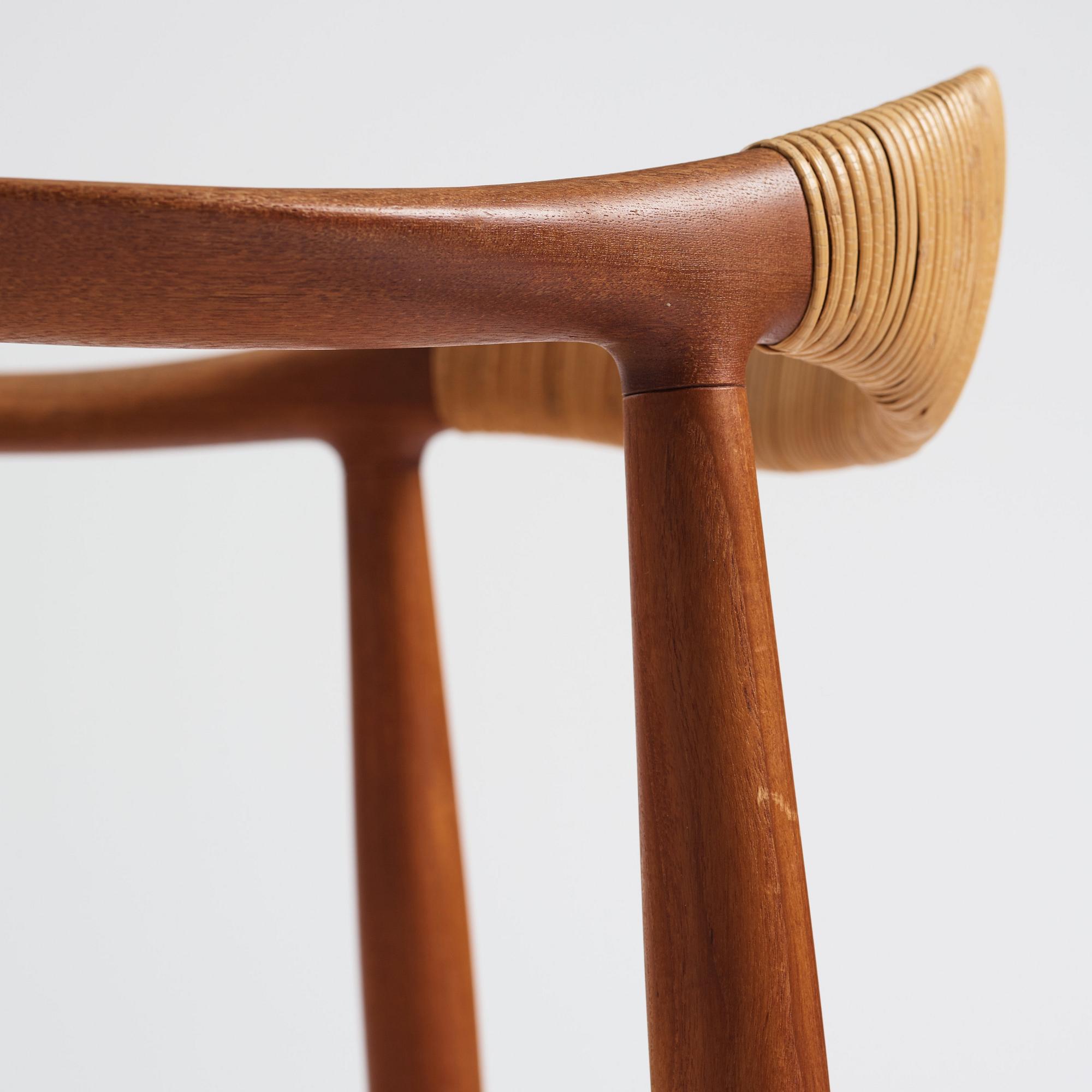 Hans J. Wegner, a pair of teak and rattan 'The Chair', JH-503, Johannes Hansen, Denmark 1950s.