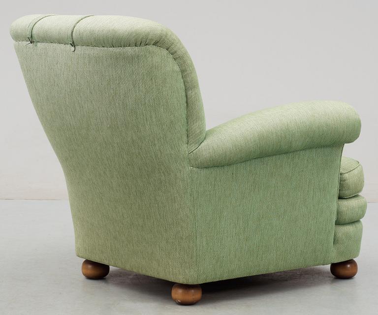 A Josef Frank armchair by Svenskt Tenn.