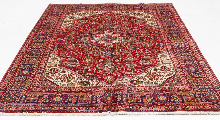 A Tabriz carpet, c. 300 x 200 cm.