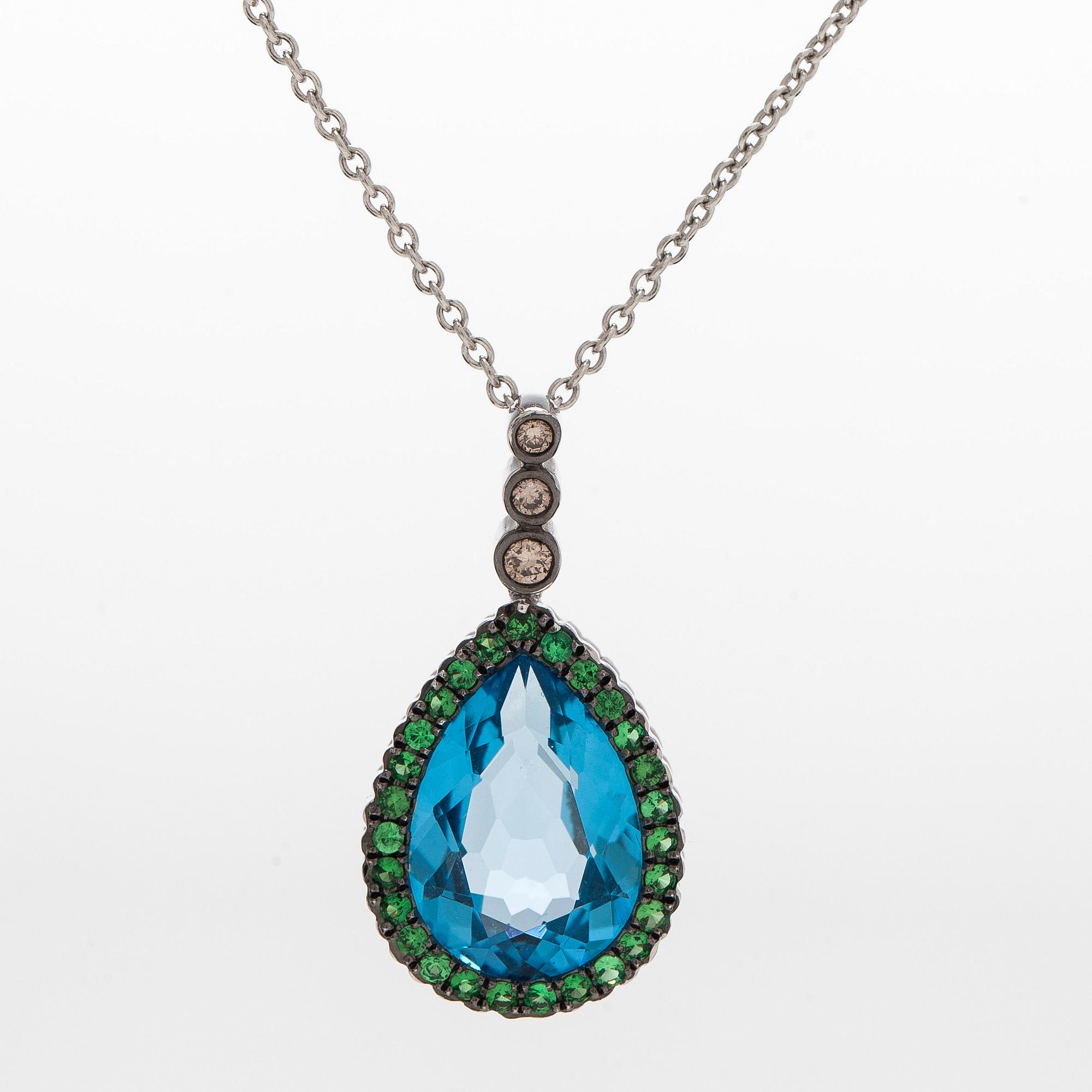 A 14K white gold necklace with pendant, topaz, brown diamonds.