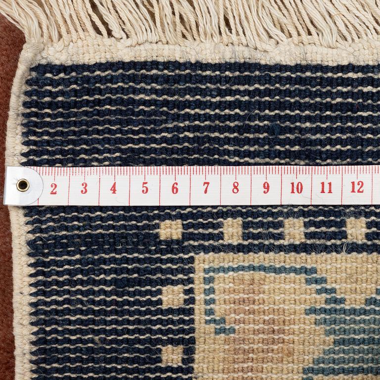 A semi-antique chinese 'antique finish' rug, c. 244 x 153 cm.