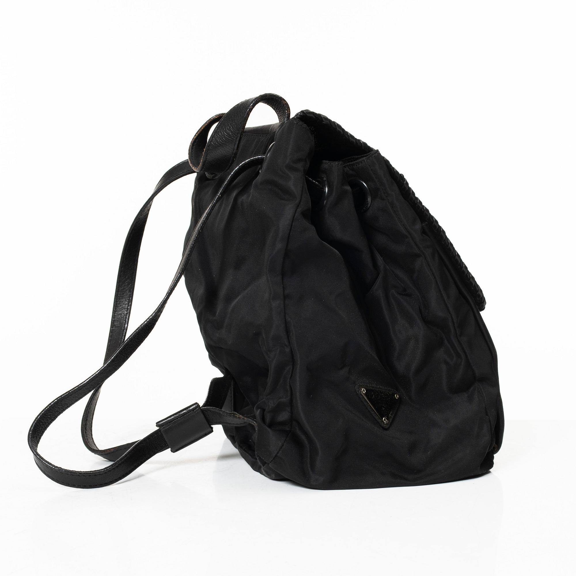 Prada, A nylon and leather backpack.