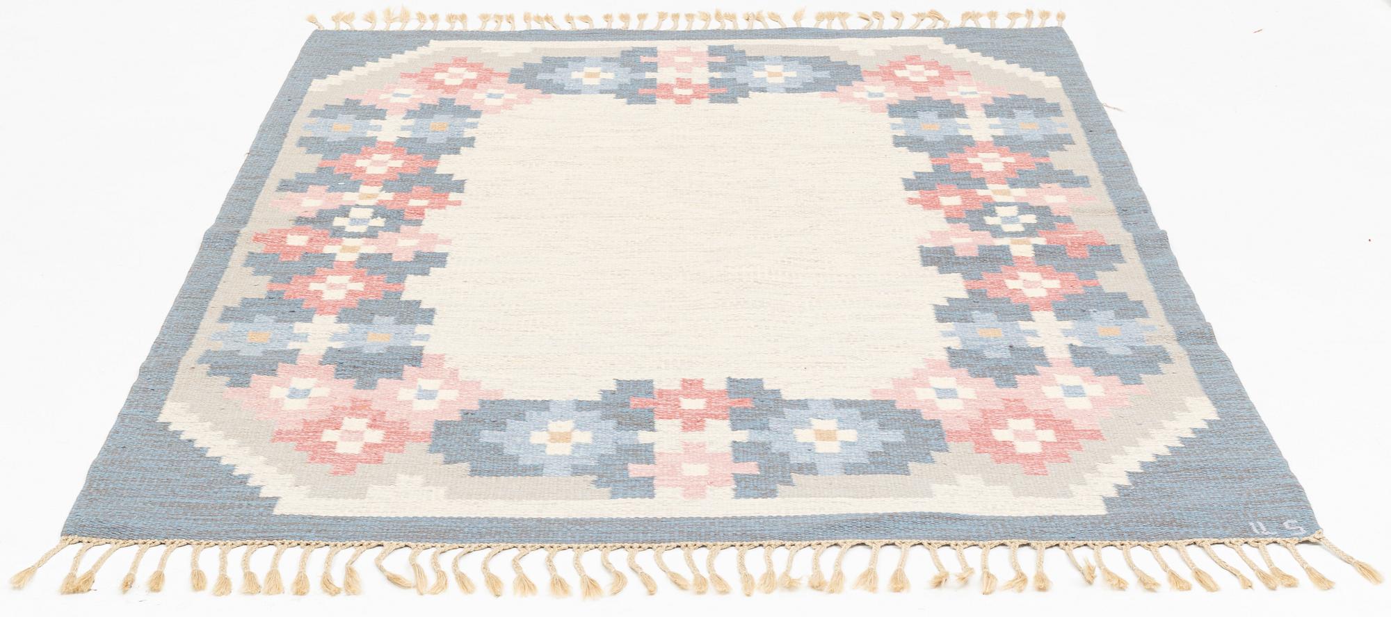 A flat weave carpet, signed  ILS, Alestalon Mattokutomo, Kauhava, Finland, c.  230 x 158 cm.