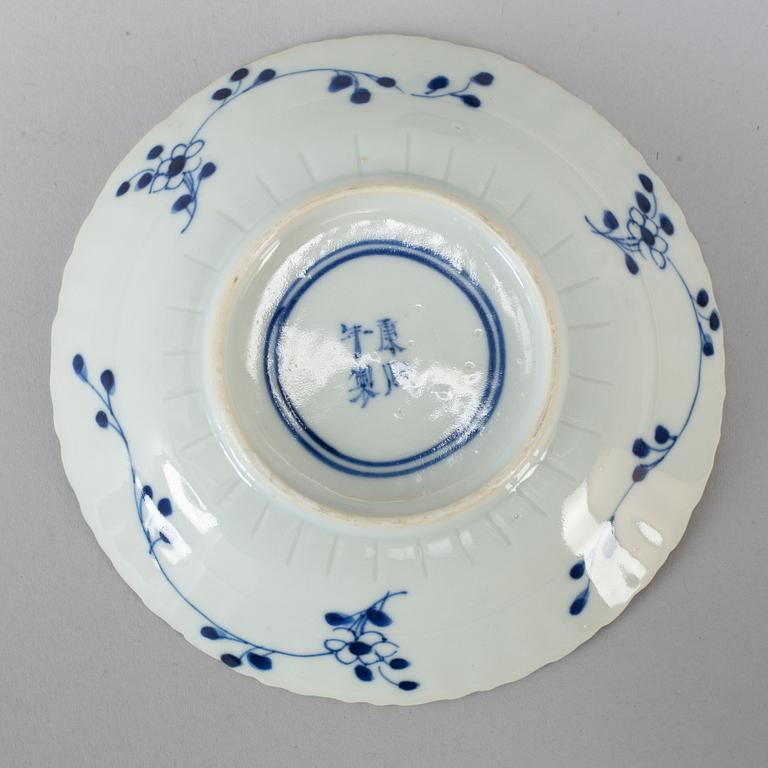 Six Chinese blue and white cups with dishes, early 20th century.