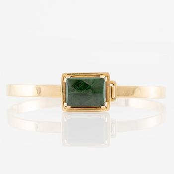 Bracelet 18K gold with green stone.