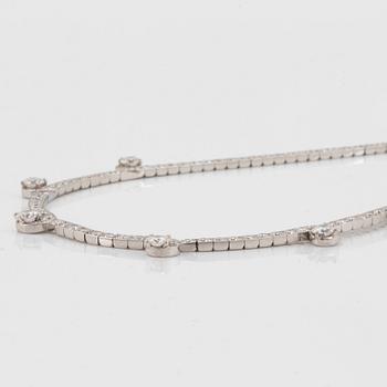 A Cartier necklace in platinum and 18K gold set with round brilliant-cut diamonds.