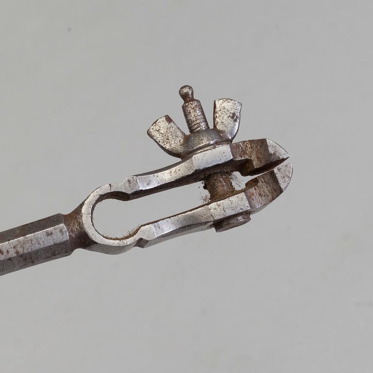 AN 18TH CENTURY STEEL SILVERSMITH'S TOOL.