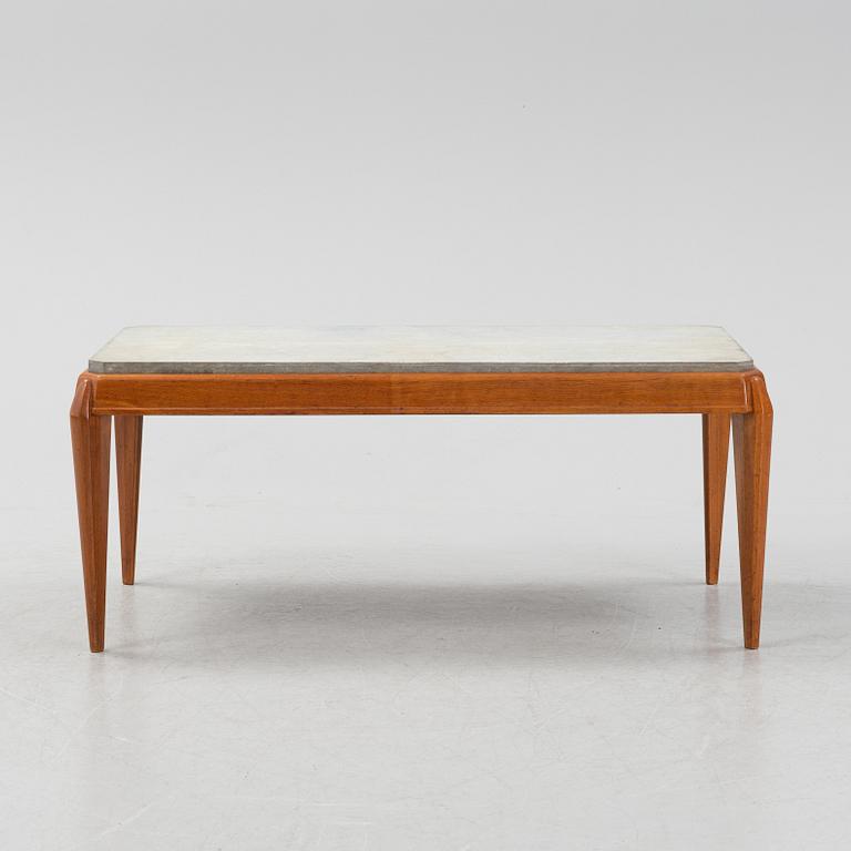 A mid 20th Century coffee table with a stone top.