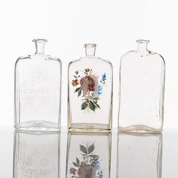 A set of seven glass bottles, 19th Century/circa 1900.
