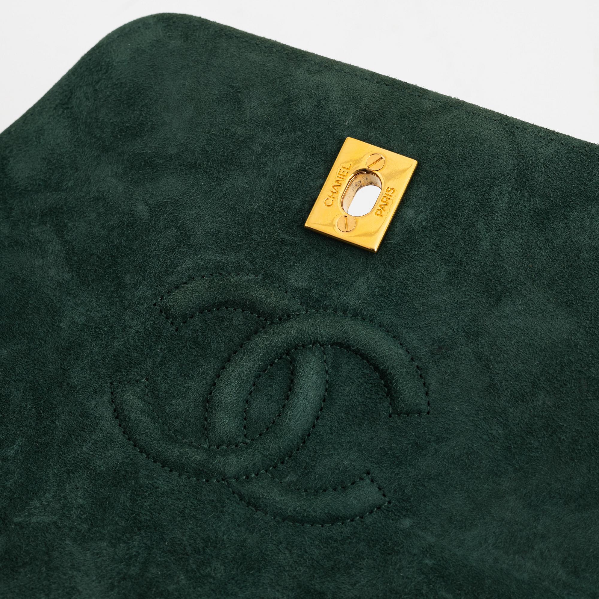 Chanel, a green suede bag with pouch, 1989-1991.