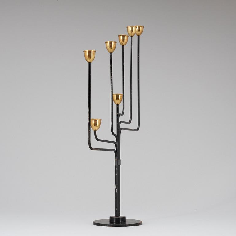 A Piet Hein brass and black lacquered metal candelabrum, 1950's-60's.