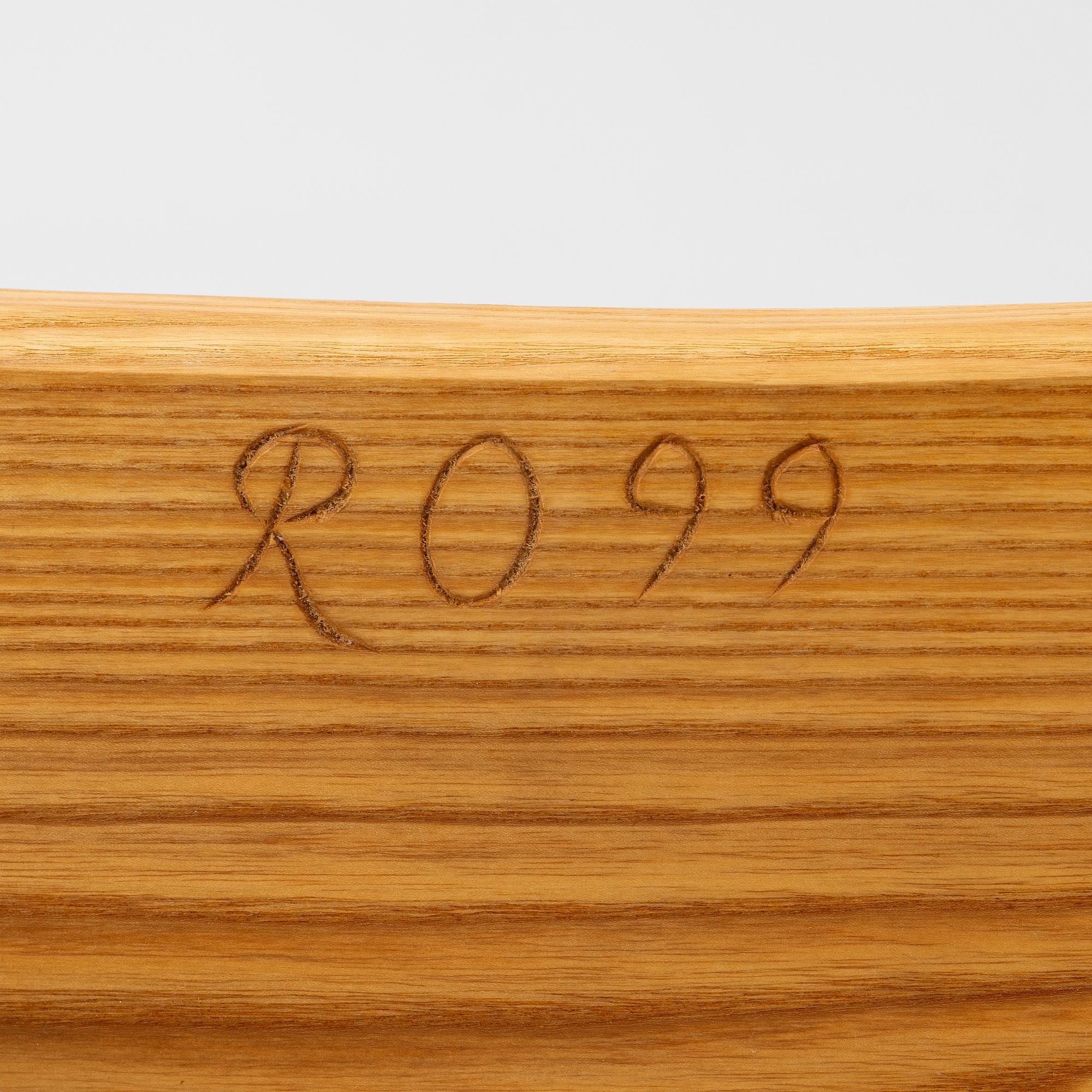 A solid pine stool, signed RO -99, Sweden.
