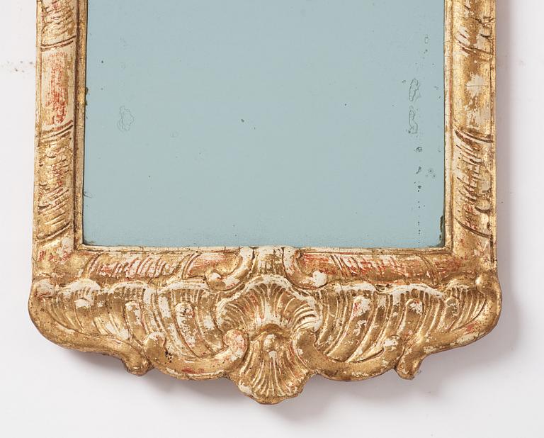 A Swedish gitlwood rococo mirror, Stockholm, later part 18th century.