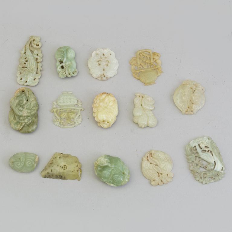 A set of 14 Chinese pendants/charms, some nephrite.