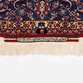 A semi-antique Isfahan carpet, Central Persia, signed (Ali) Seirafian, 328 x 250 cm.